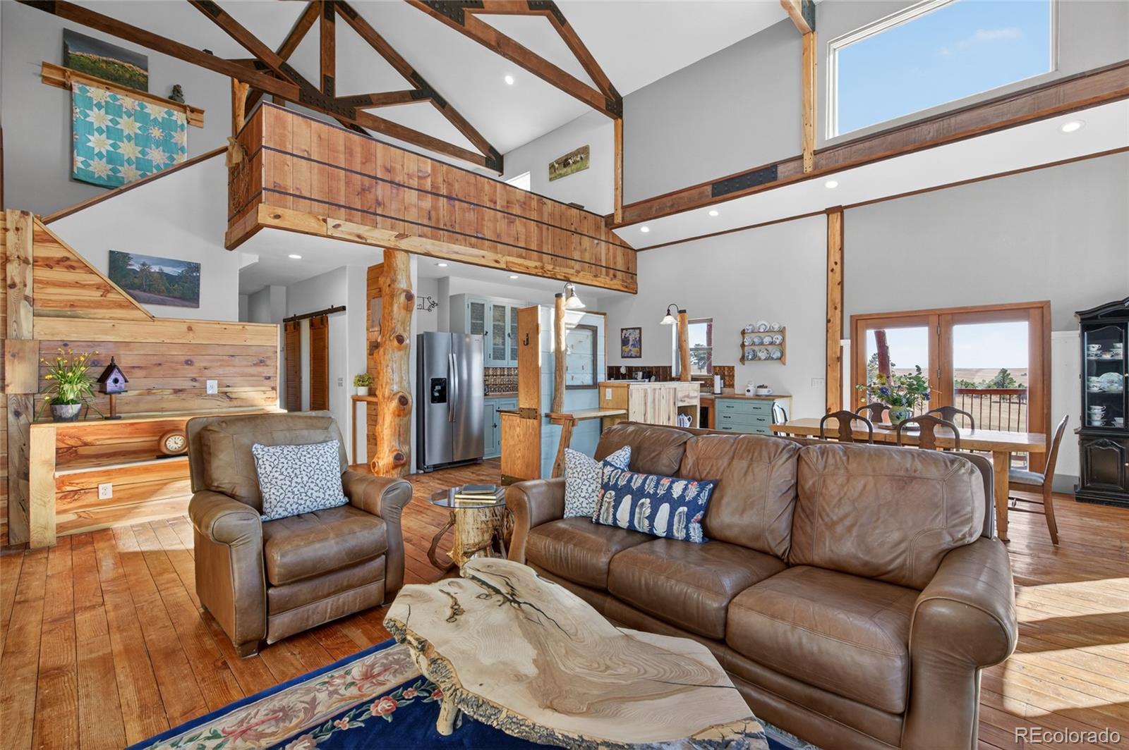 a view of a livingroom with furniture and a rug