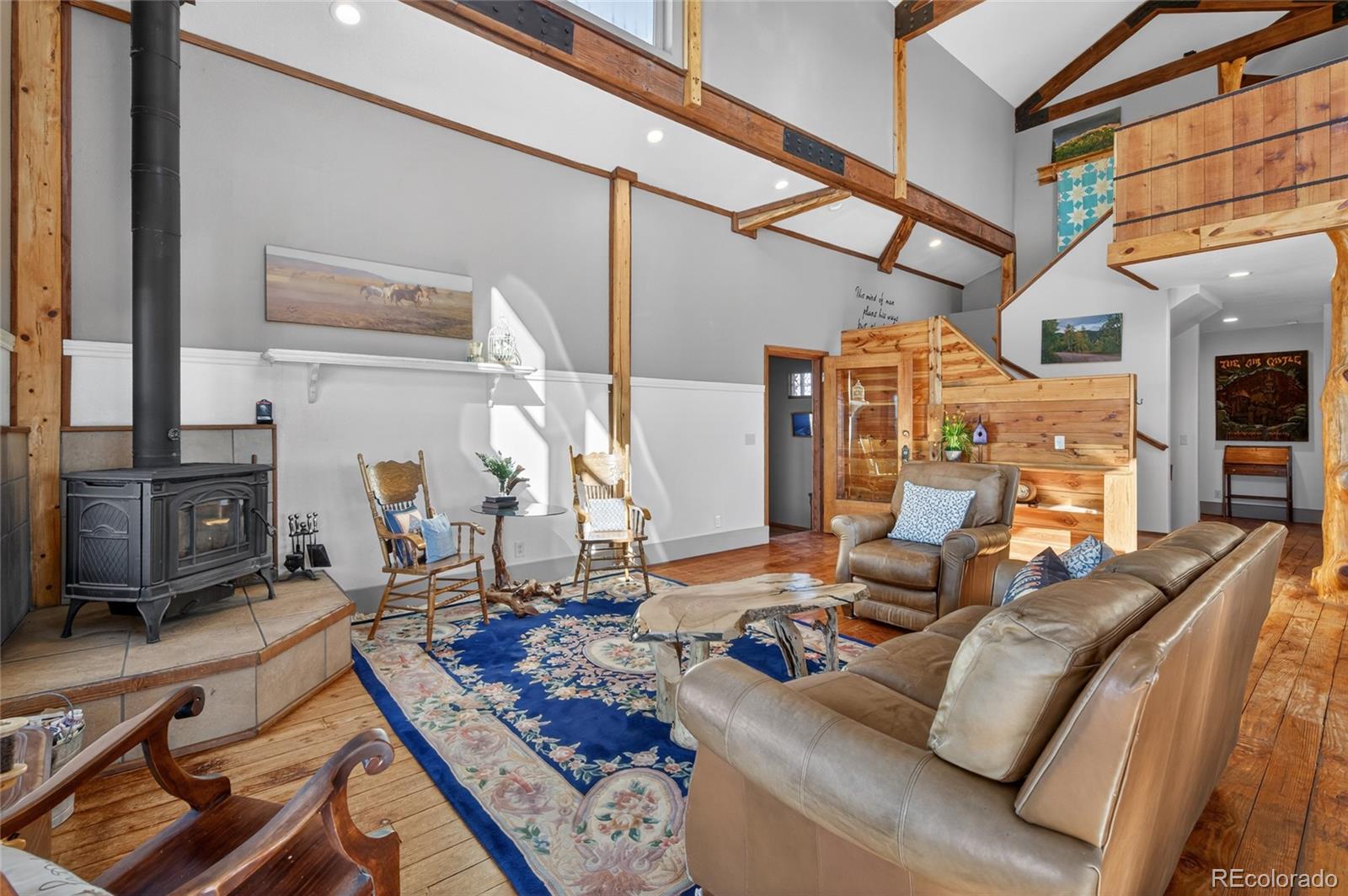 31885 Ridge Road Ramah, CO 80832 - Photo 13 of 47 a living room with furniture rug and wooden floor