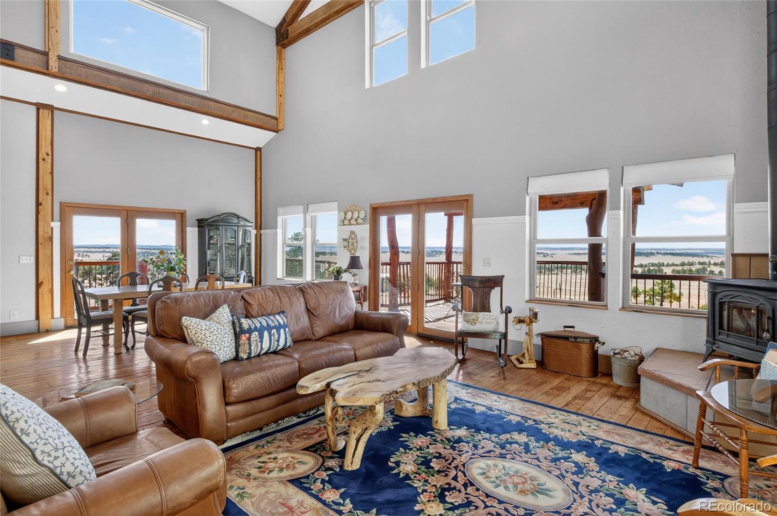 31885 Ridge Road Ramah, CO 80832 - Photo 15 of 47 a living room with furniture wooden floor and a table