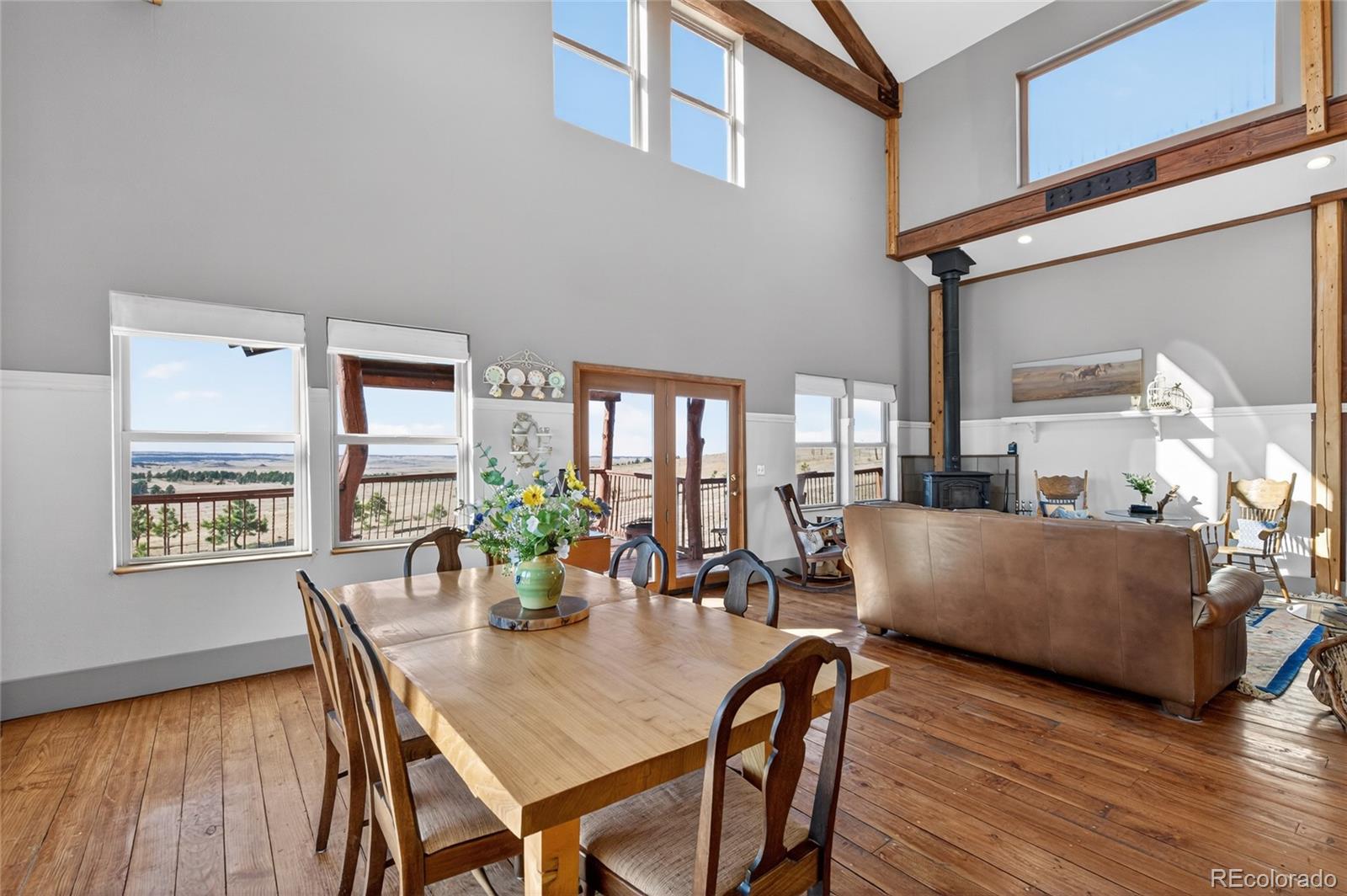 31885 Ridge Road Ramah, CO 80832 - Photo 17 of 47 a view of a dining room with furniture and wooden floor