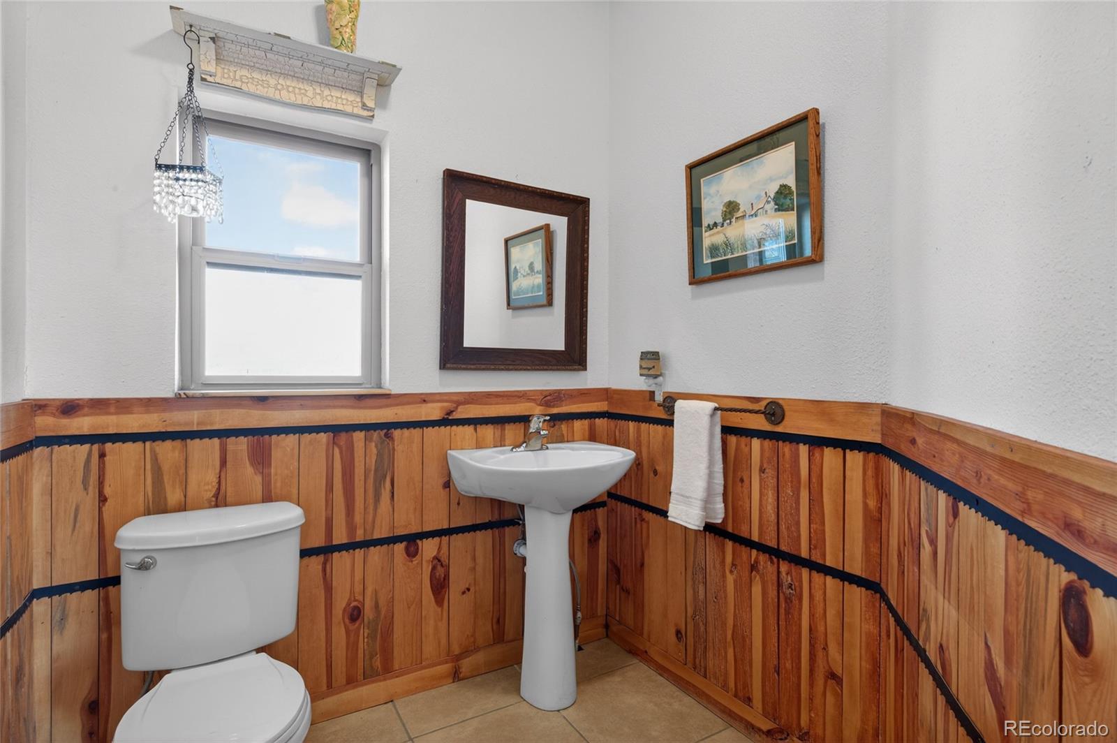 31885 Ridge Road Ramah, CO 80832 - Photo 23 of 47 a bathroom with a sink a toilet and mirror