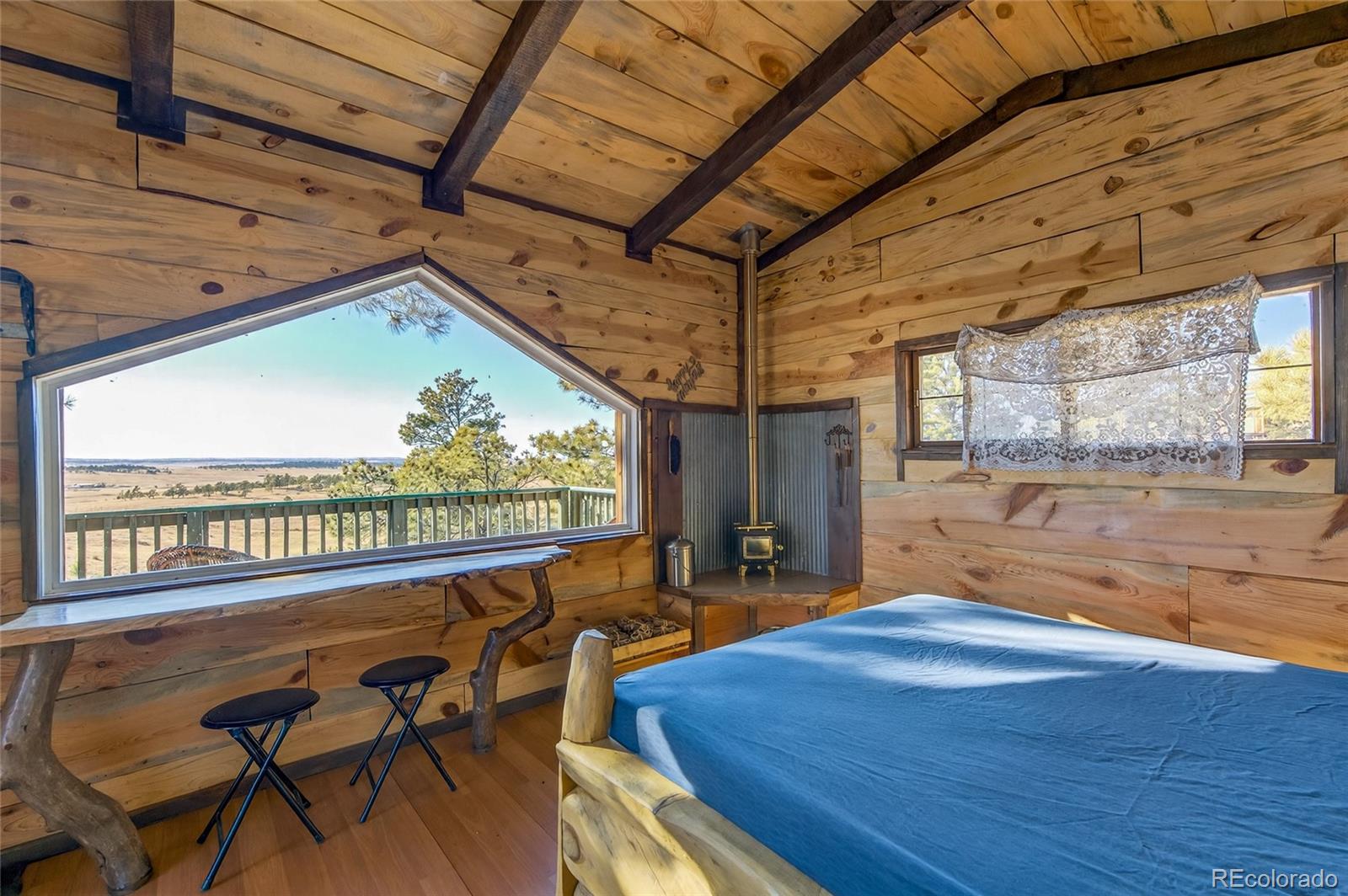 31885 Ridge Road Ramah, CO 80832 - Photo 37 of 47 a view of a patio with a table chairs and a patio