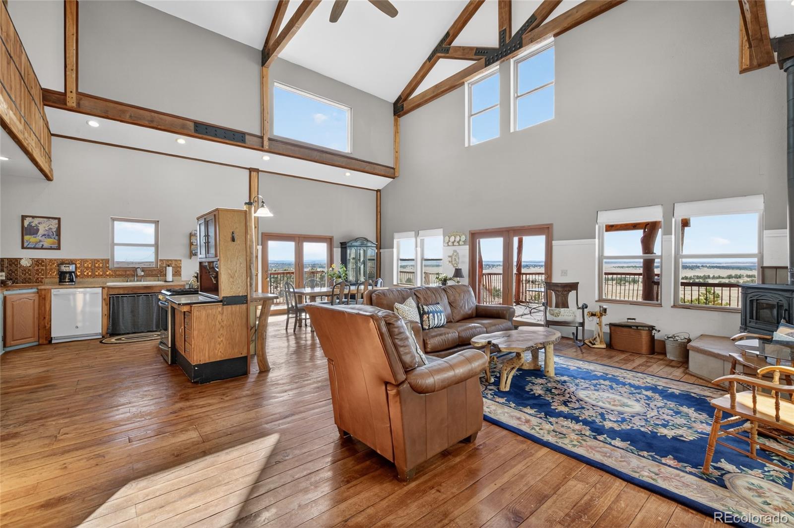 31885 Ridge Road Ramah, CO 80832 - Photo 6 of 47 a living room with furniture wooden floor and a large window