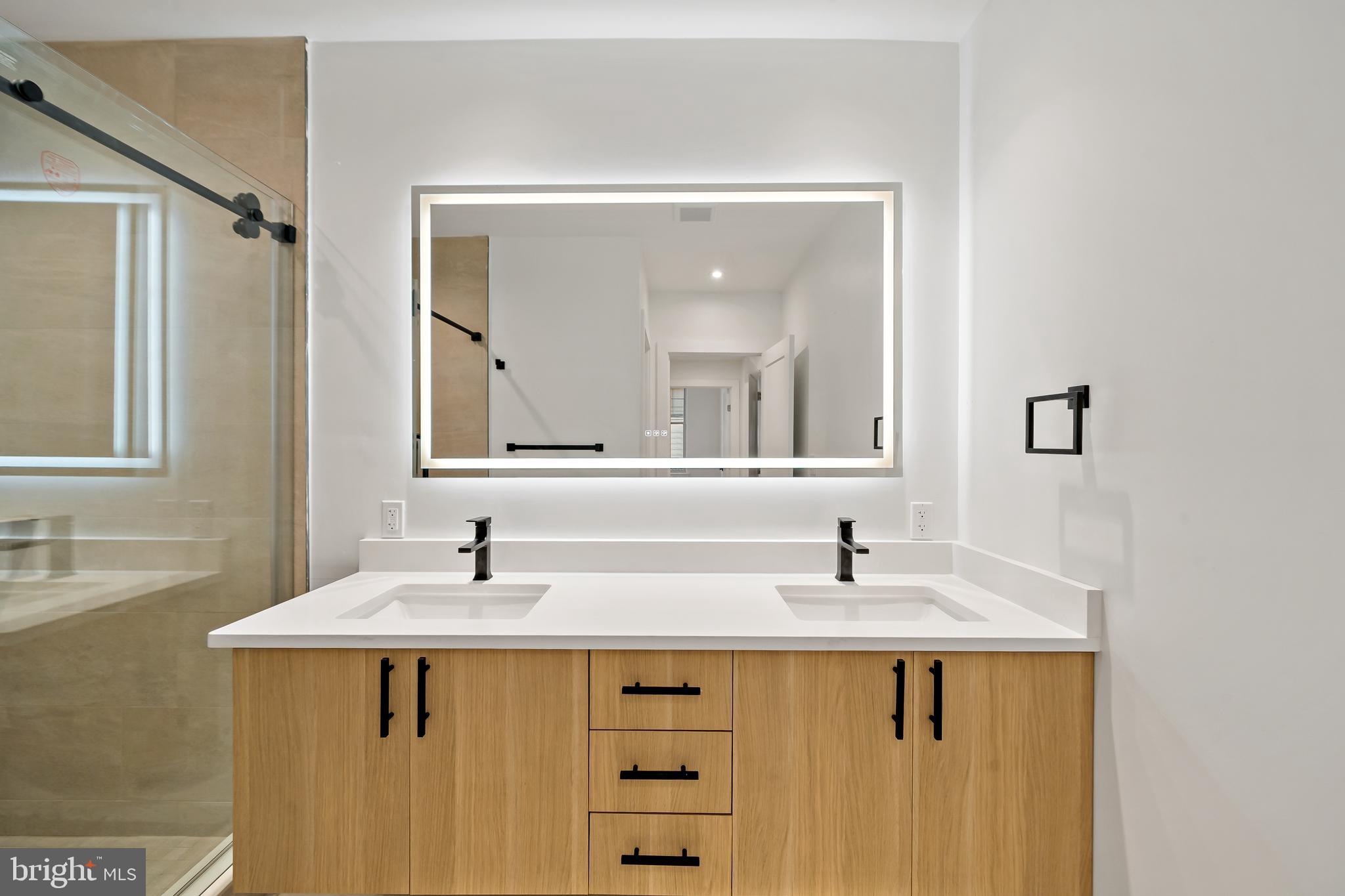 326 North 12th Street, Unit 201 Philadelphia, PA 19107 - Photo 17 of 22 a bathroom with a sink and a mirror