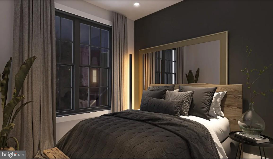 326 North 12th Street, Unit 201 Philadelphia, PA 19107 - Photo 2 of 11 a bedroom with a bed and a mirror