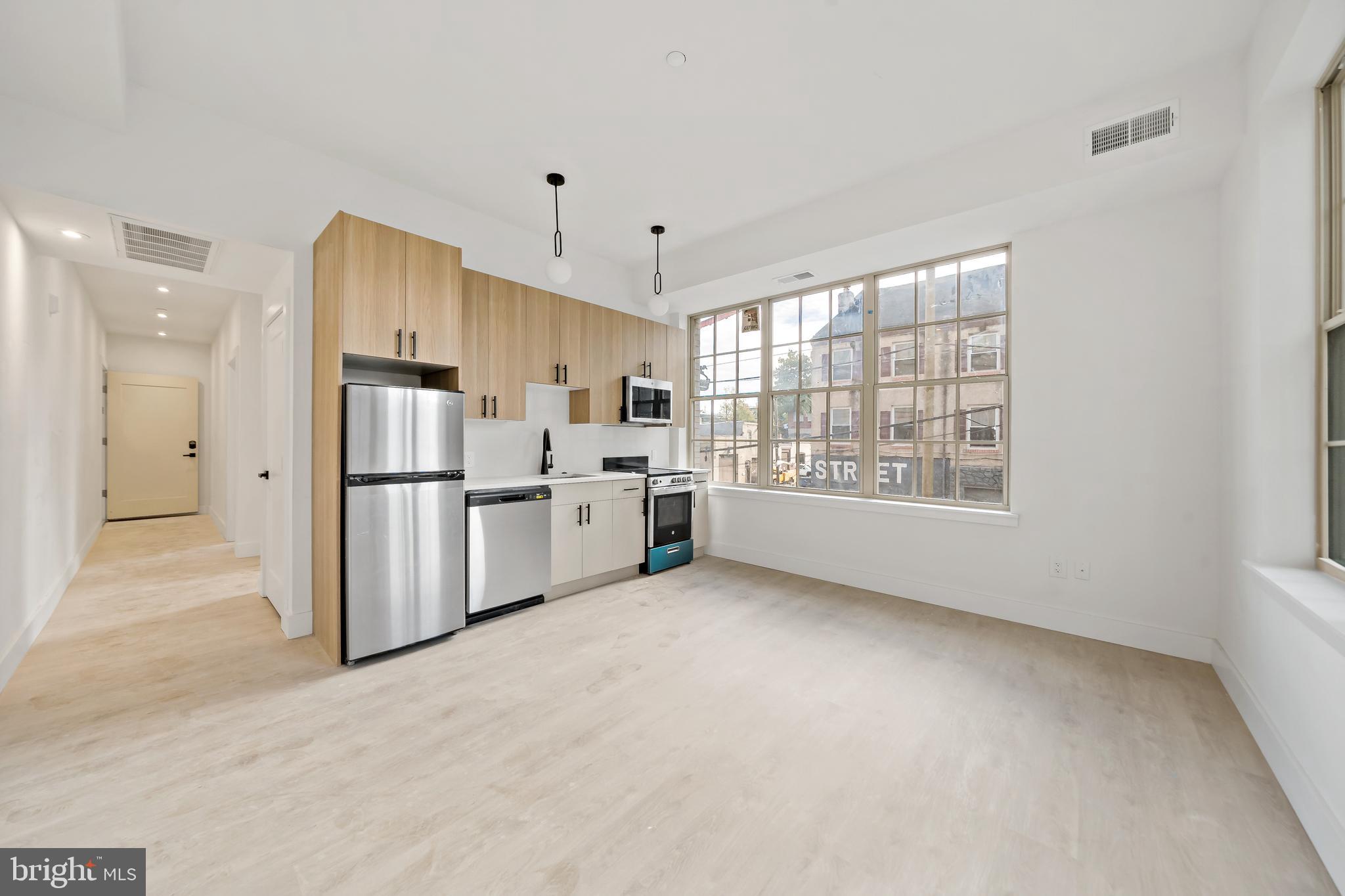 326 North 12th Street, Unit 201 Philadelphia, PA 19107 - Photo 22 of 22 a view of kitchen with stainless steel appliances refrigerator oven and cabinets
