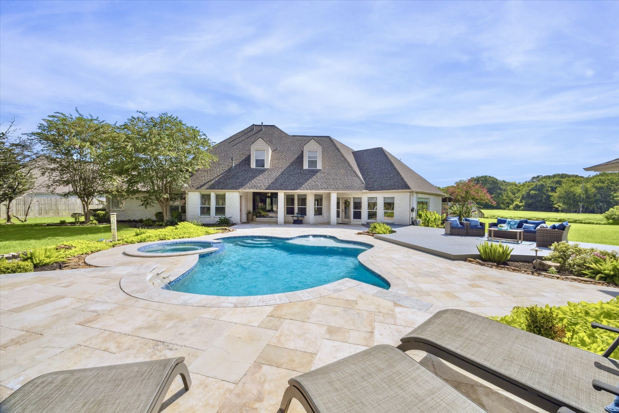 2904 Bridle Path Lane Friendswood, TX 77546 - Photo 1 of 49 The pool is beautifully designed and features a gorgeous setting with a spacious deck—ideal for relaxing, entertaining, and enjoying time with family and friends.