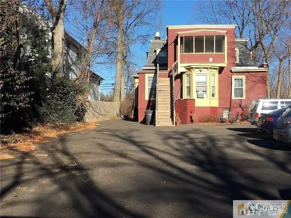 a view of a brick house with many windows