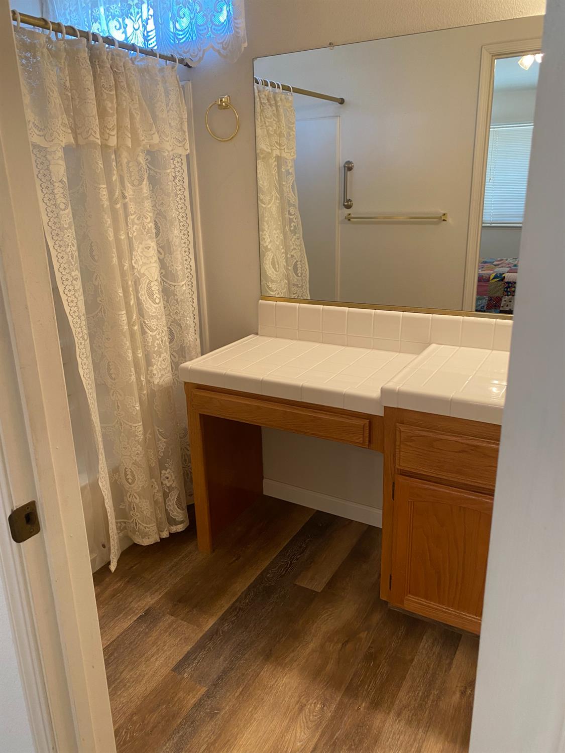 609 Merlot Avenue Madera, CA 93637 - Photo 20 of 45 a bathroom with a sink and a mirror