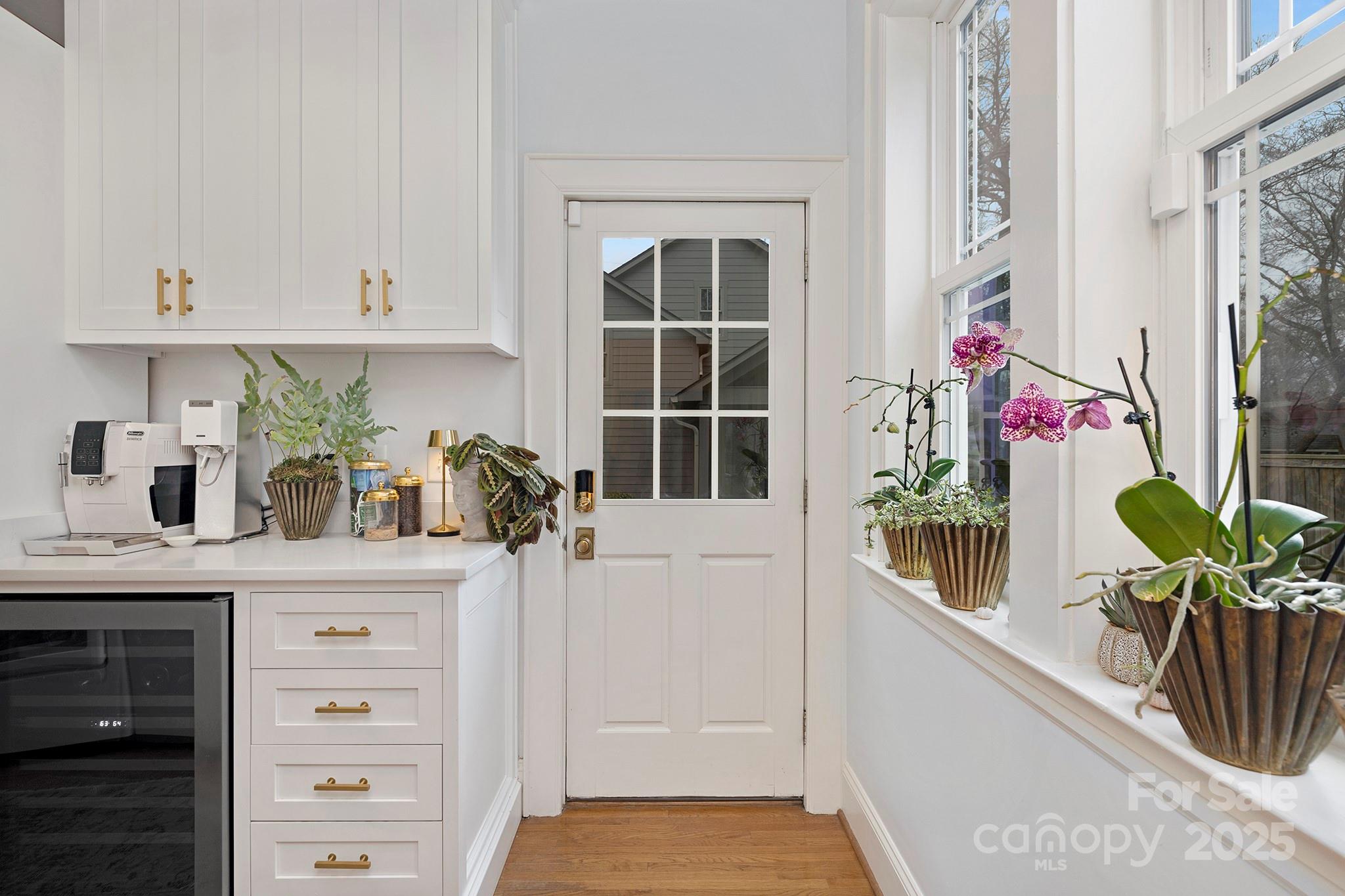 2000 Winter Street Charlotte, NC 28205 - Photo 11 of 40 a kitchen with stainless steel appliances white cabinets and a window