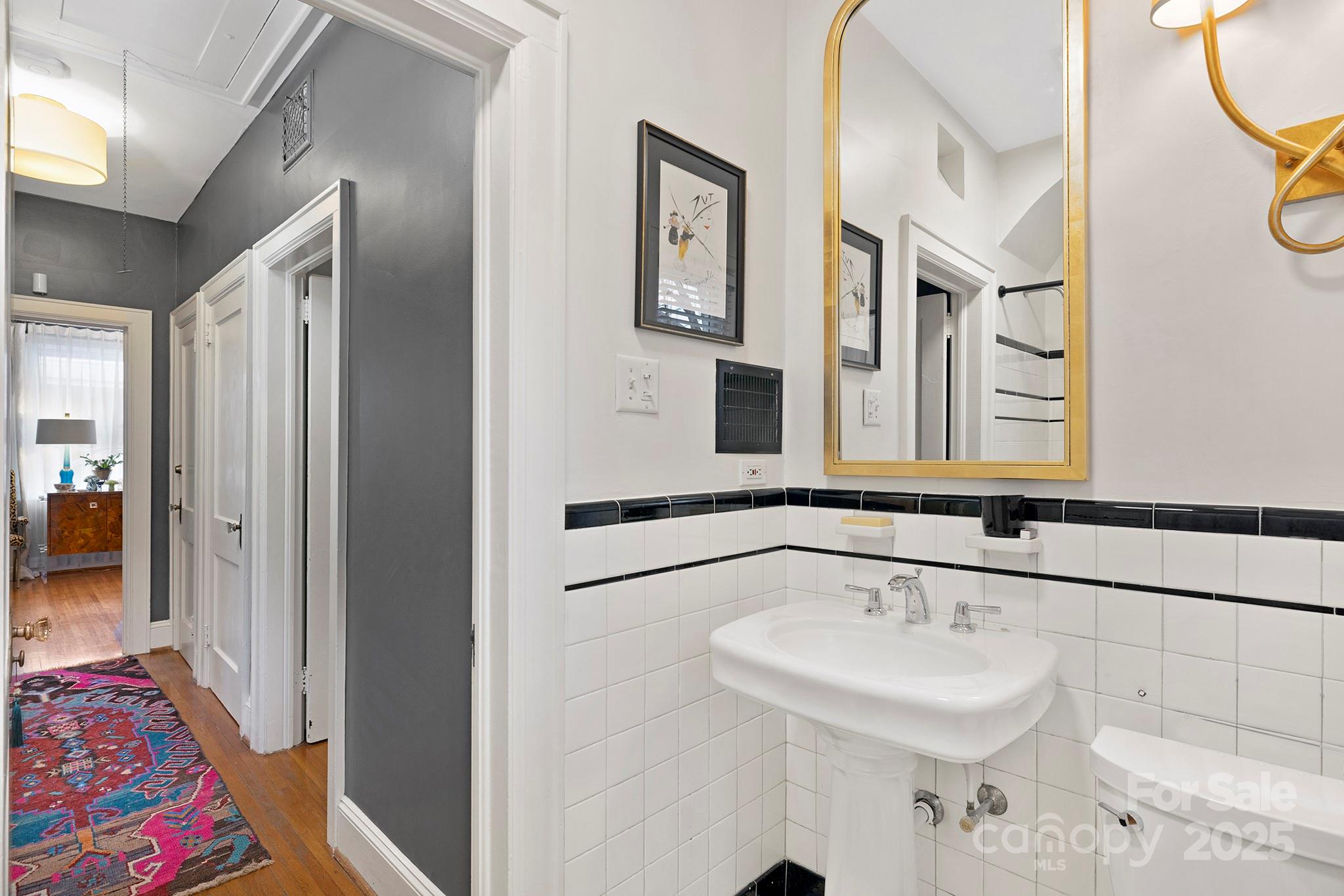 2000 Winter Street Charlotte, NC 28205 - Photo 14 of 40 a bathroom with a sink and a mirror