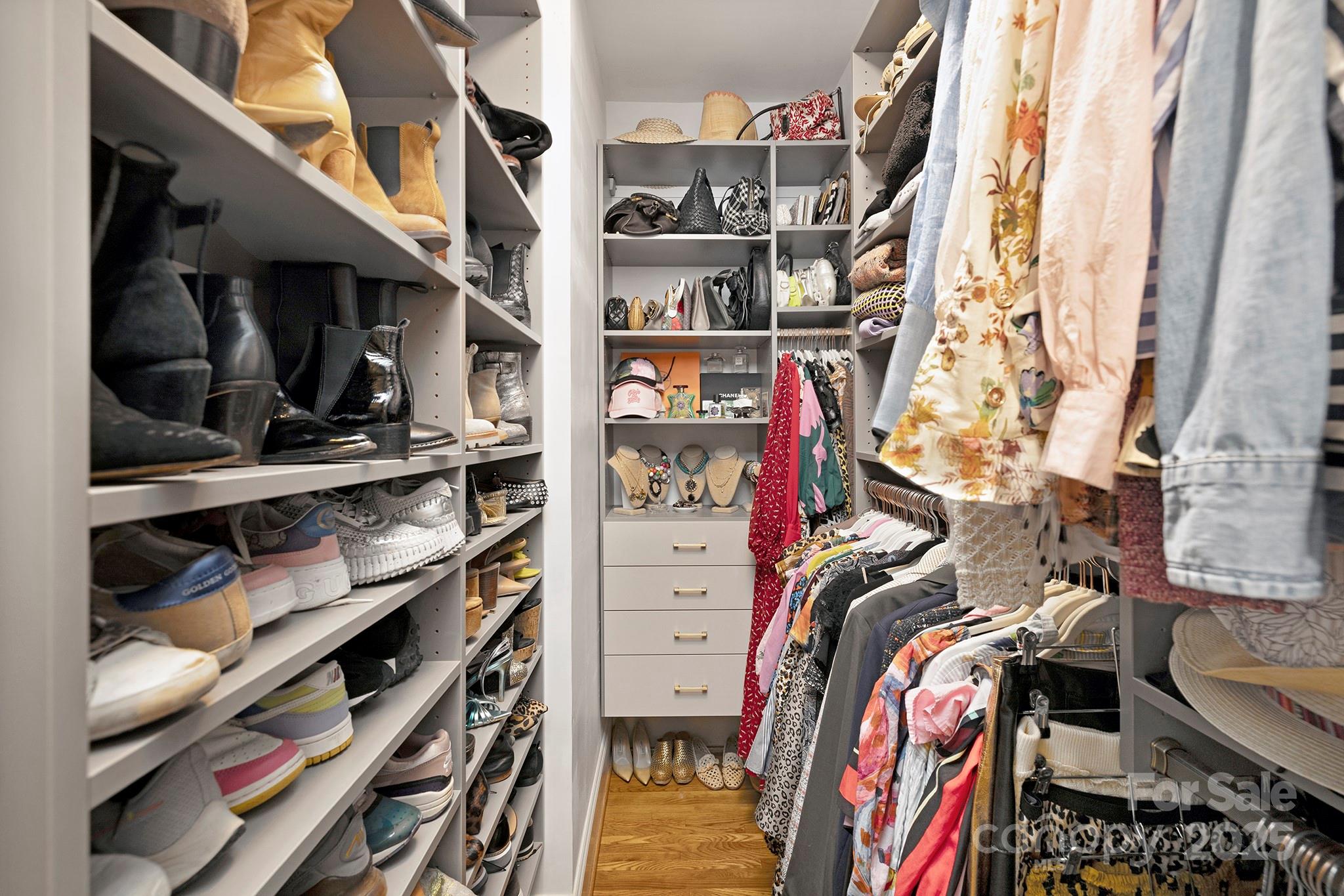 2000 Winter Street Charlotte, NC 28205 - Photo 19 of 40 a view of walk in closet with clothes and shoes