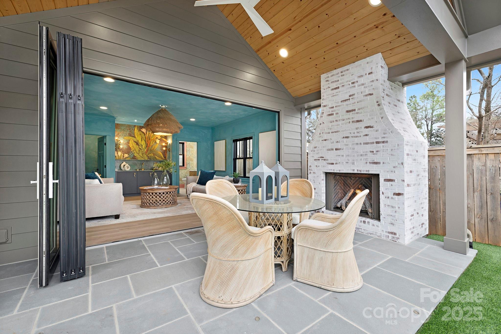 2000 Winter Street Charlotte, NC 28205 - Photo 23 of 40 a dining room with furniture and a fireplace