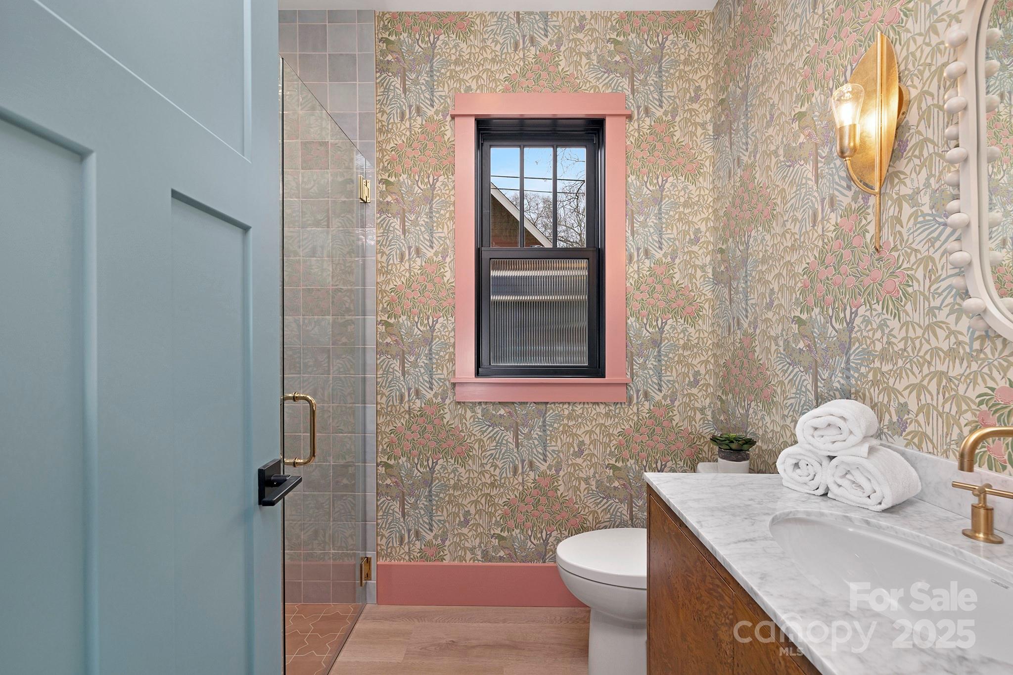 2000 Winter Street Charlotte, NC 28205 - Photo 26 of 40 a bathroom with a granite countertop toilet sink and mirror