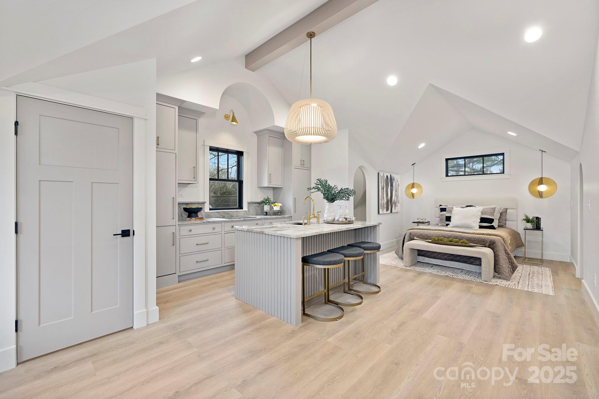 2000 Winter Street Charlotte, NC 28205 - Photo 30 of 40 a living room with furniture and a chandelier