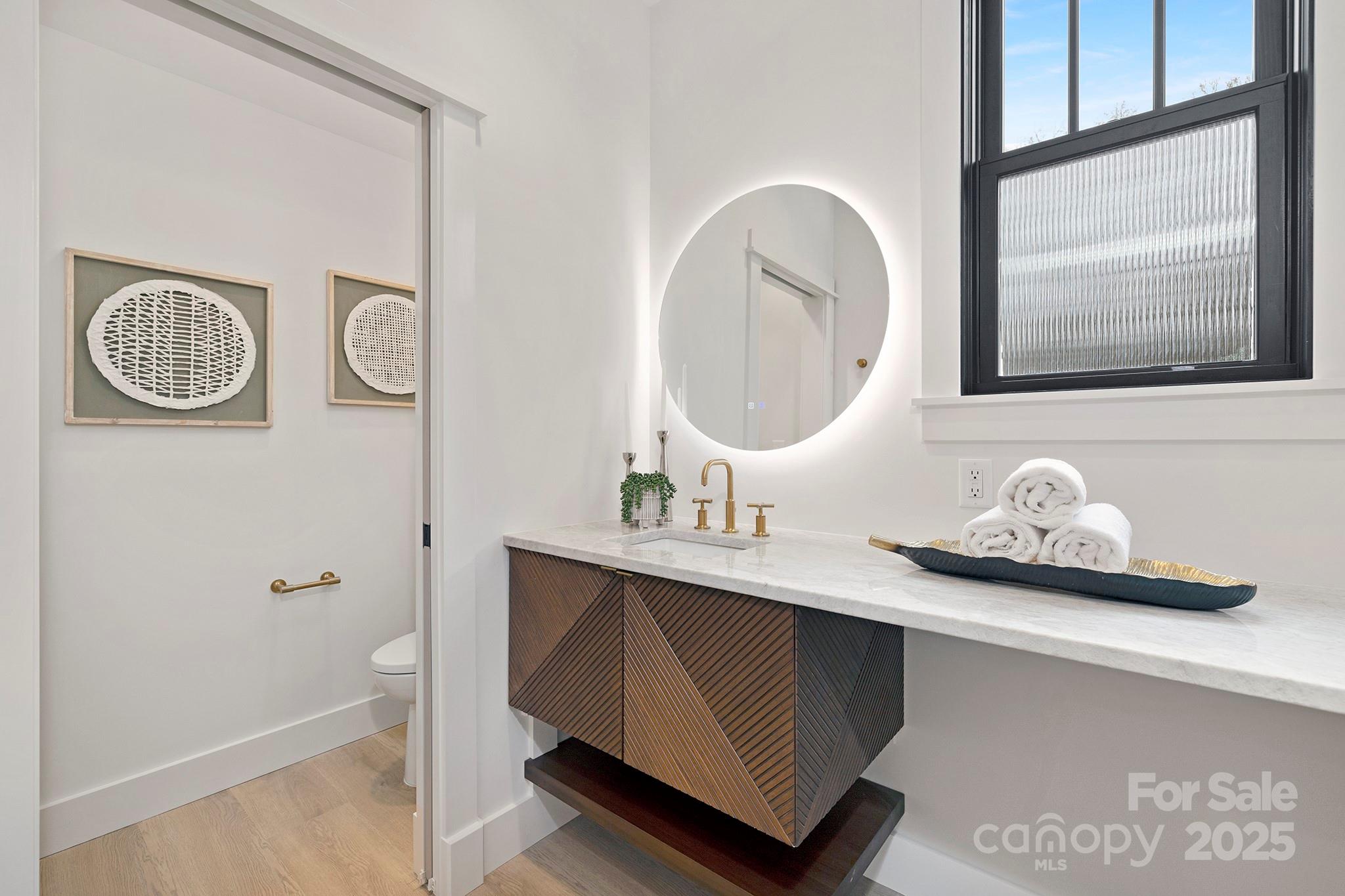 2000 Winter Street Charlotte, NC 28205 - Photo 35 of 40 a bathroom with a granite countertop sink and a mirror