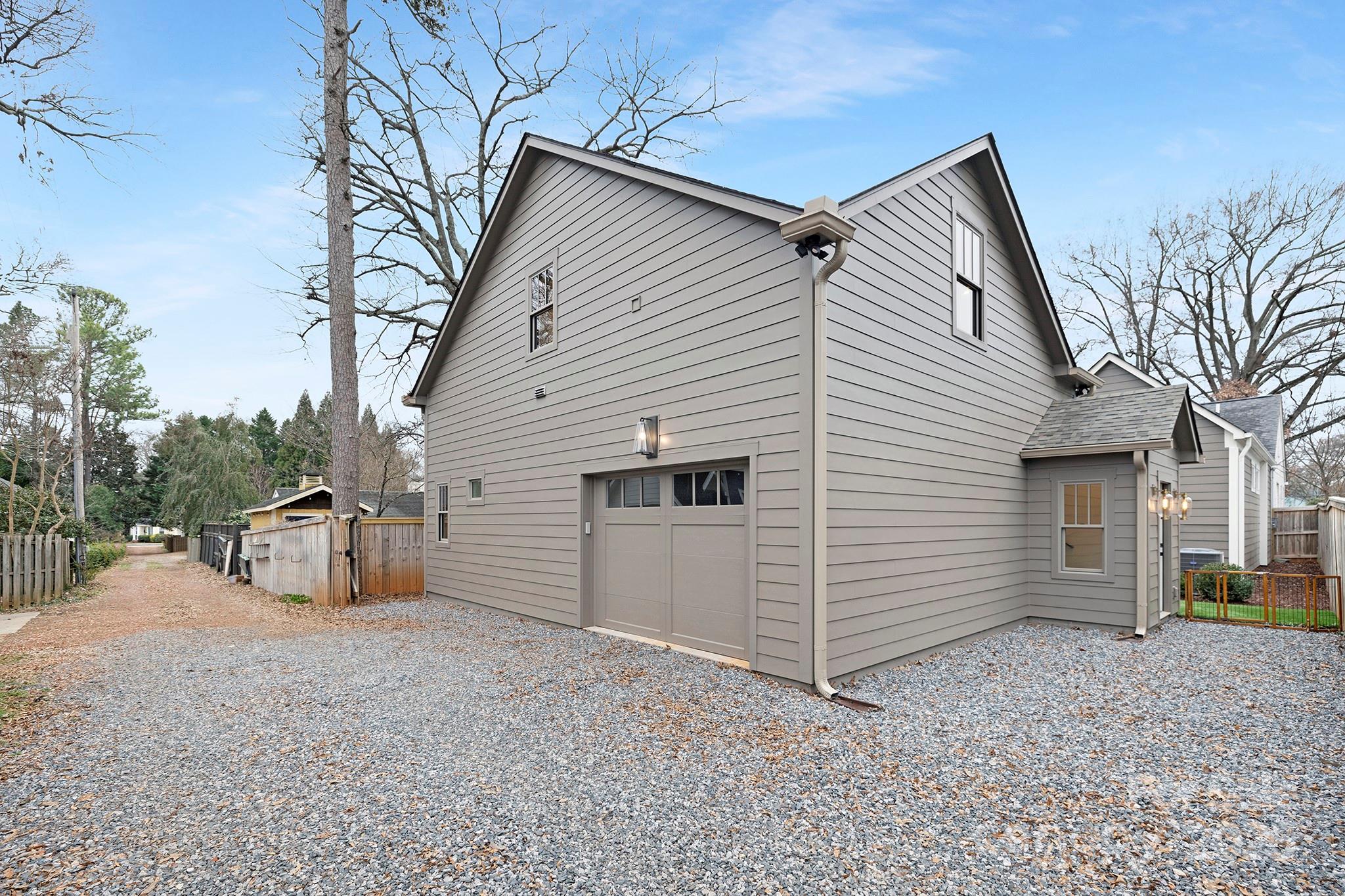 2000 Winter Street Charlotte, NC 28205 - Photo 36 of 40 a view of a house with backyard and trees