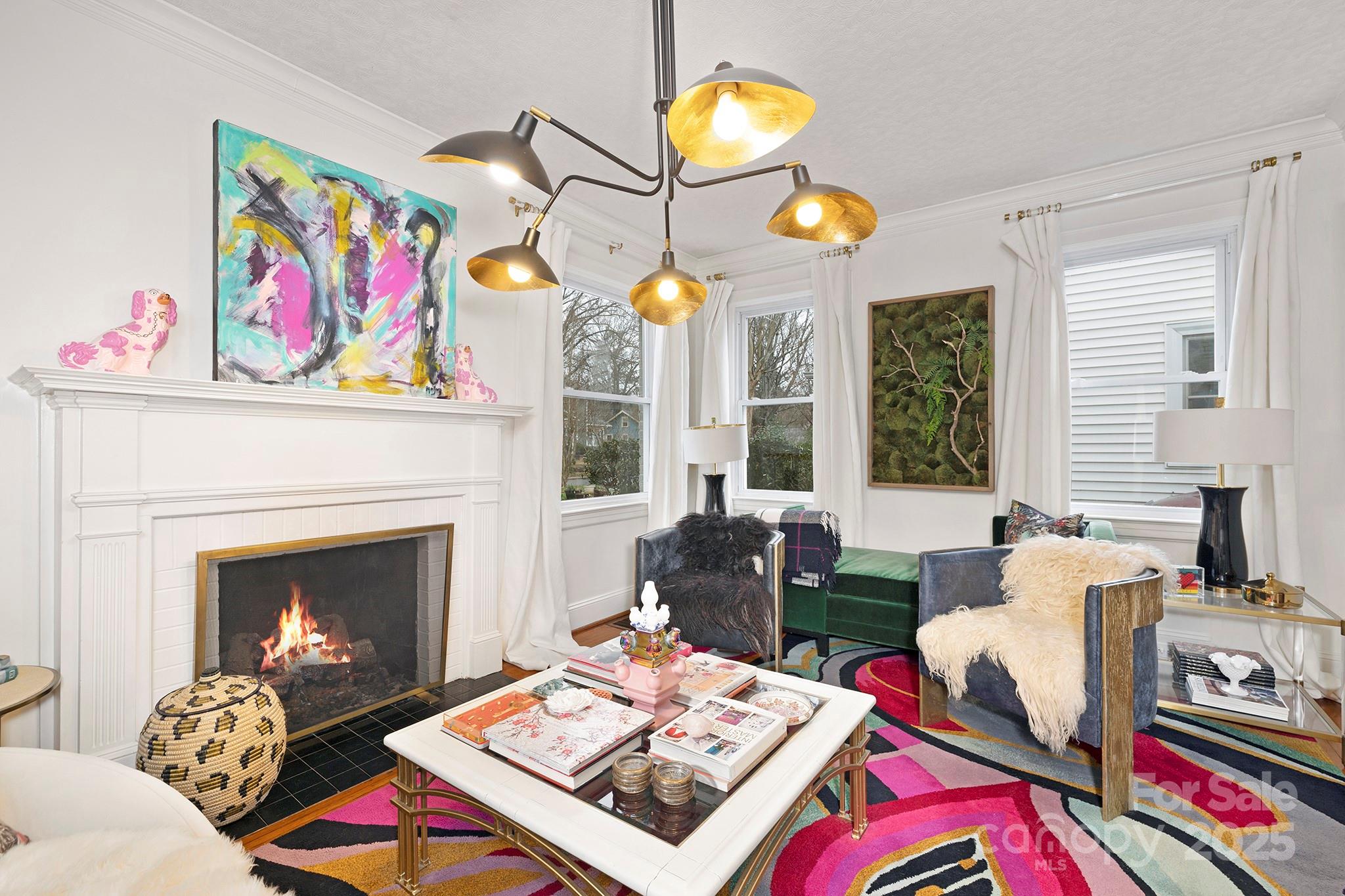 2000 Winter Street Charlotte, NC 28205 - Photo 4 of 40 a living room with furniture a rug and a fireplace