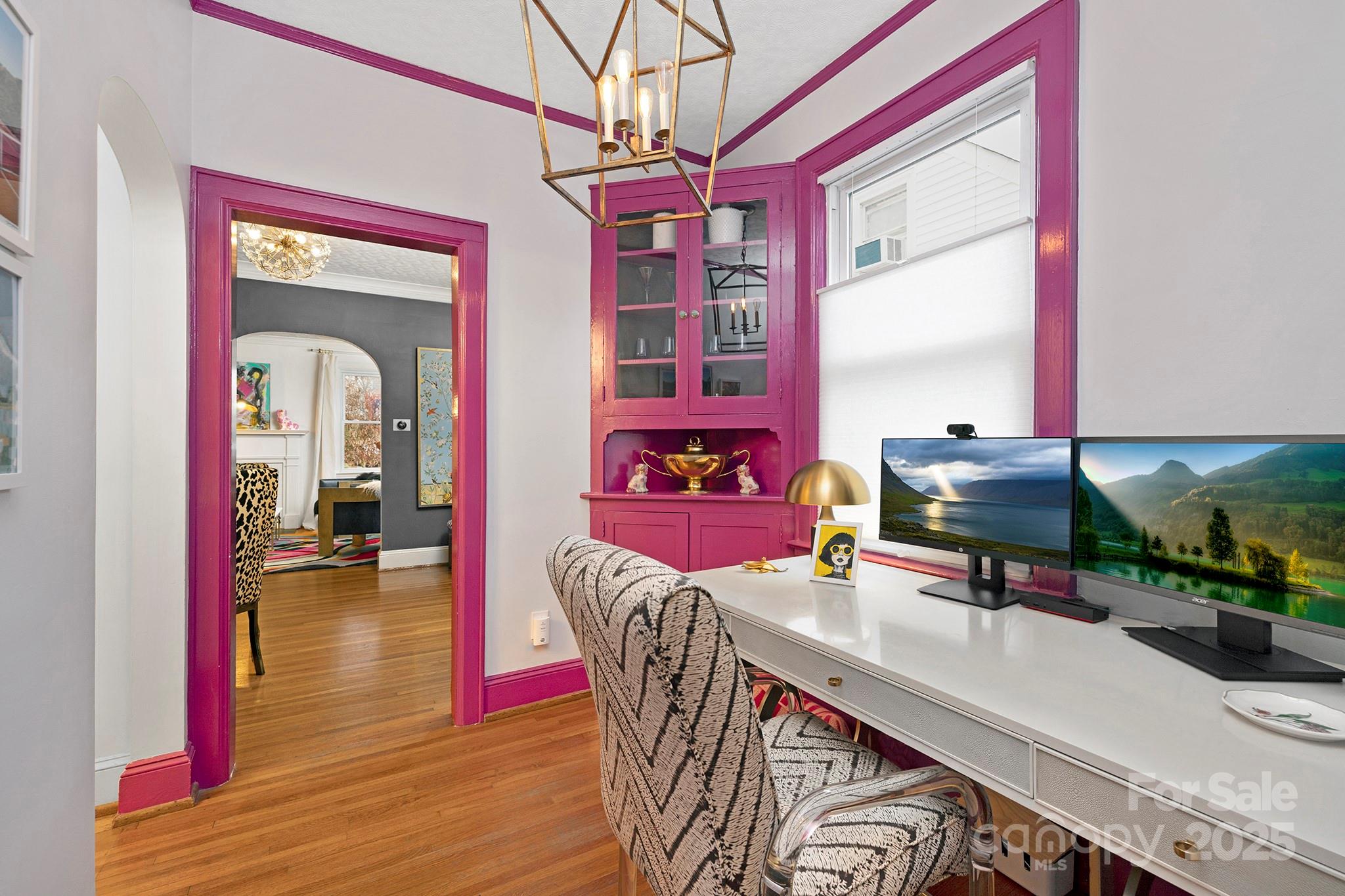 2000 Winter Street Charlotte, NC 28205 - Photo 7 of 40 a dining room with furniture a rug a potted plant and wooden floor