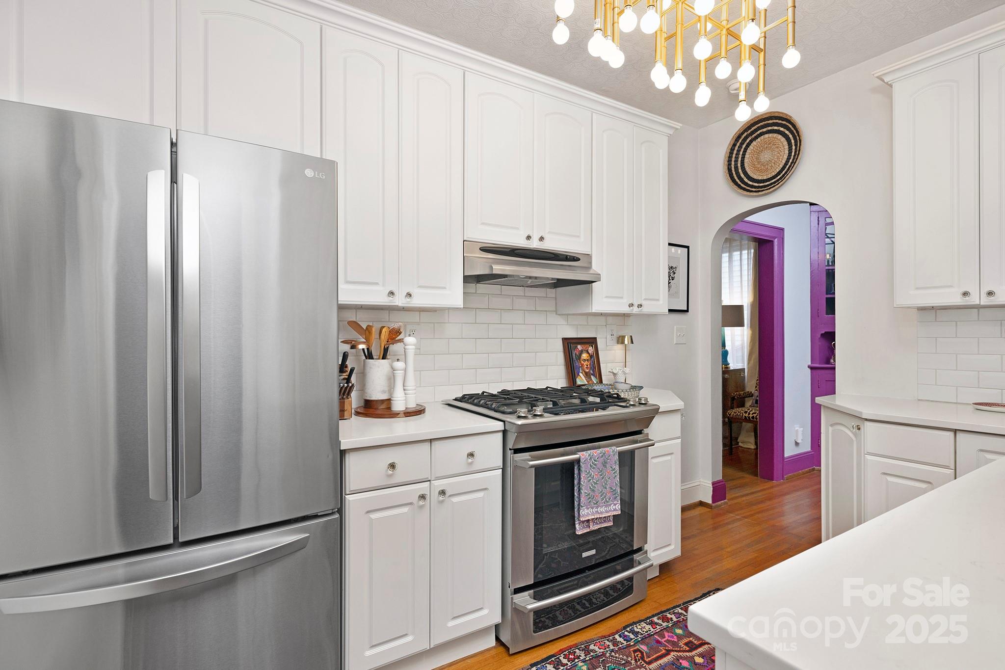 2000 Winter Street Charlotte, NC 28205 - Photo 8 of 40 a kitchen with stainless steel appliances granite countertop a refrigerator and a stove top oven
