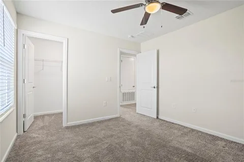 a bathroom with a double vanity sink mirror and shower