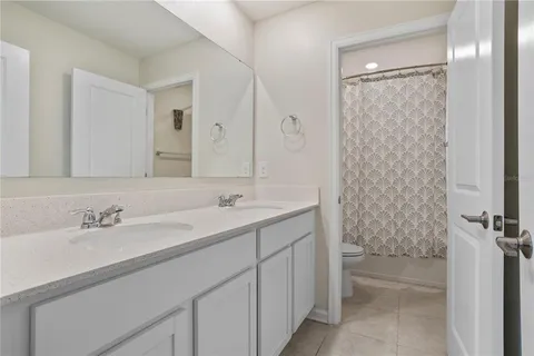 a close up of a bathtub curtain