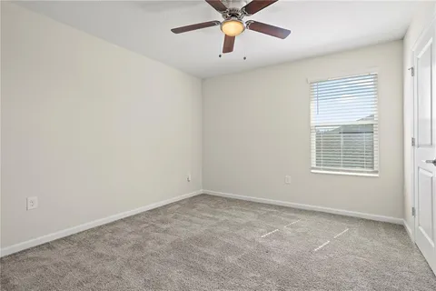a glass door with glass top table and chair