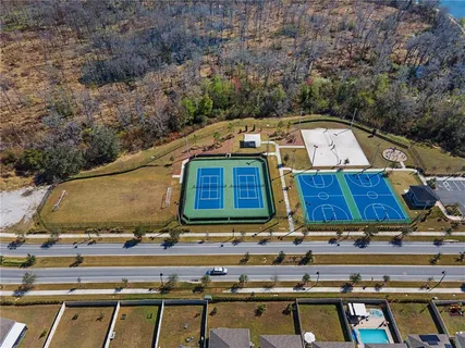 an aerial view of residential houses with outdoor space