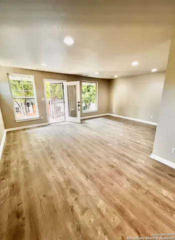 an empty room with windows