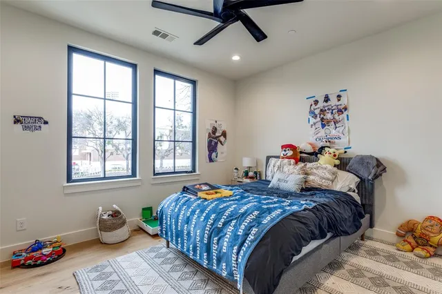 a bedroom with bed and a window