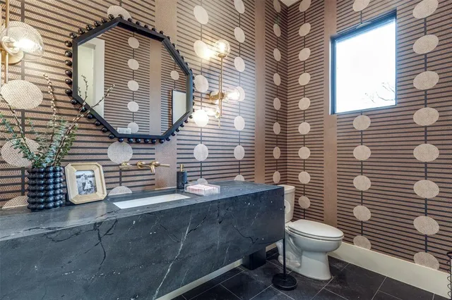 a bathroom with a toilet and a sink