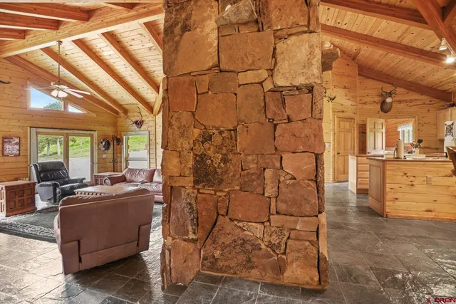 a living room with a couch and a dining table
