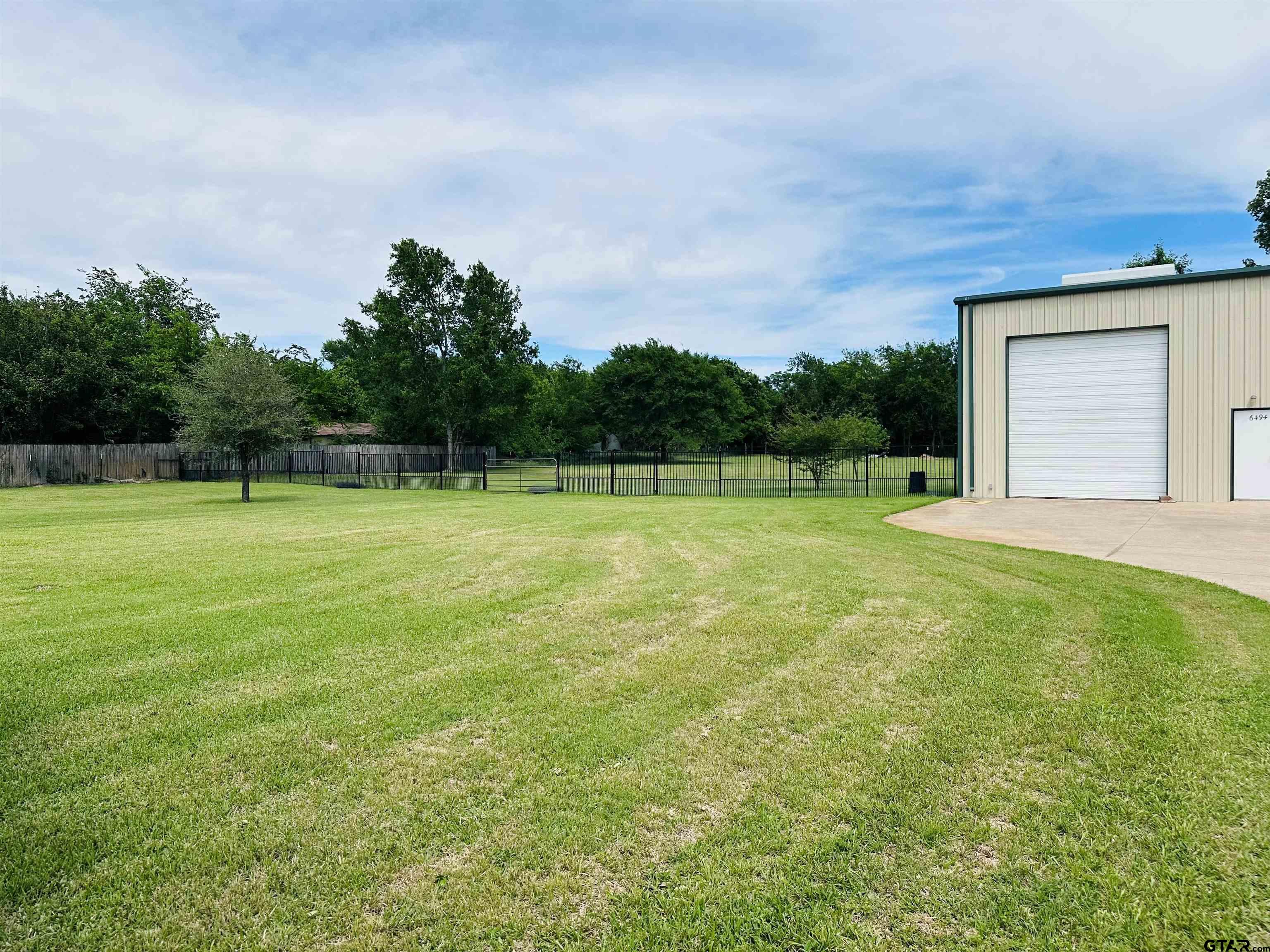 6454 Clear Creek Road Mabank, TX 75156 - Photo 13 of 17 a view of a big yard with a small yard and large trees