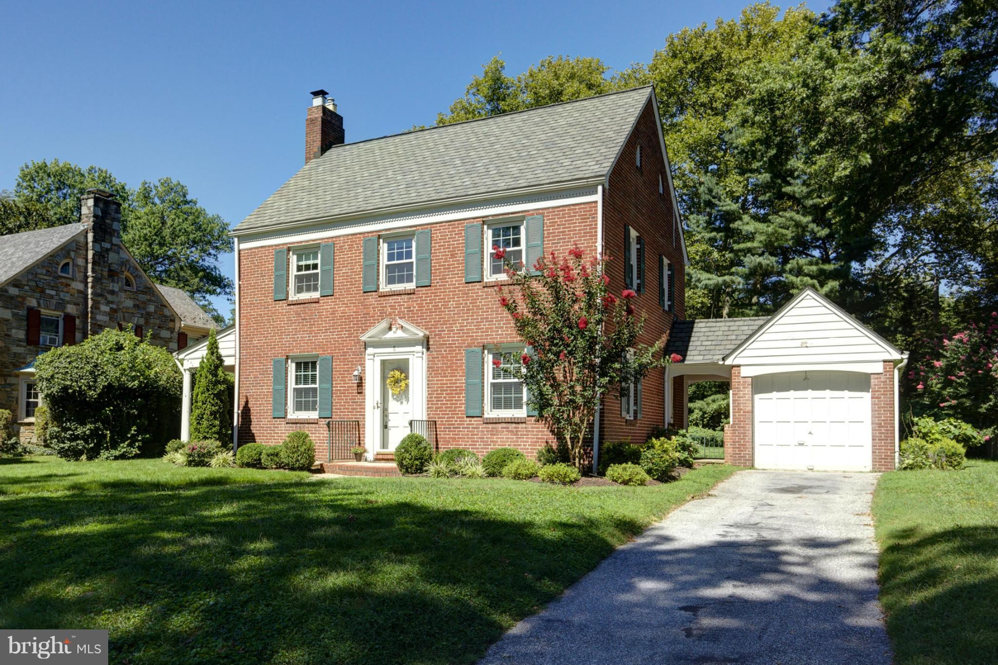 8 Aintree Road Towson, MD 21286 - Photo 2 of 27 a front view of a house with a yard and garage