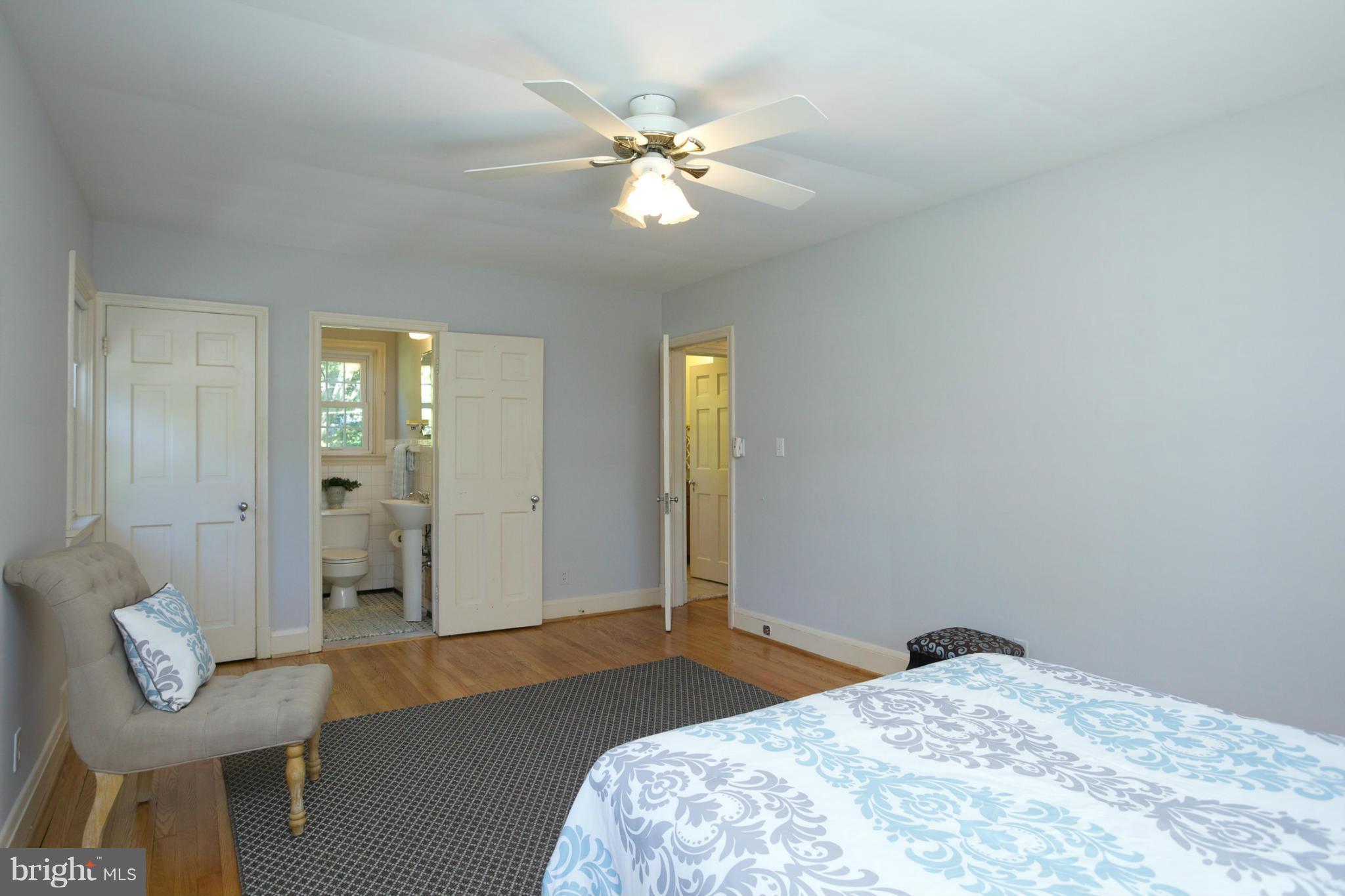 8 Aintree Road Towson, MD 21286 - Photo 15 of 27 a bedroom with a bed and a chandelier
