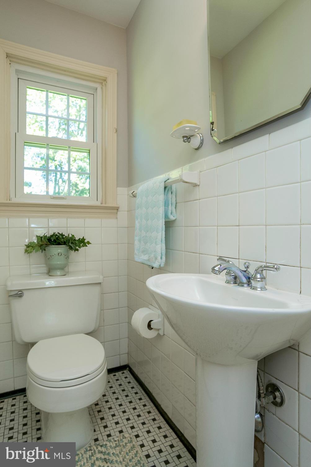 8 Aintree Road Towson, MD 21286 - Photo 16 of 27 a bathroom with a sink toilet and a mirror