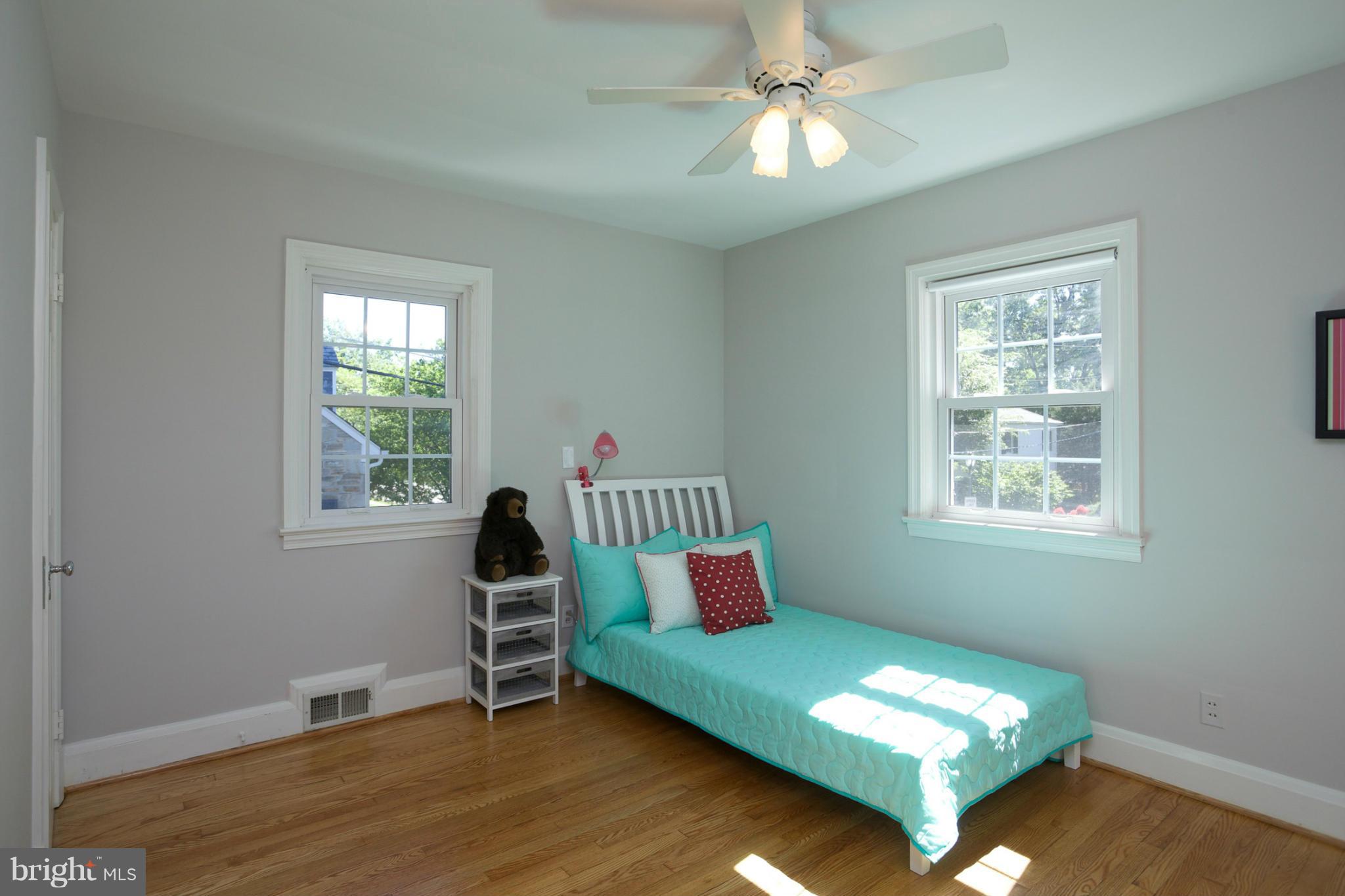 8 Aintree Road Towson, MD 21286 - Photo 17 of 27 a living room with furniture lamp and window