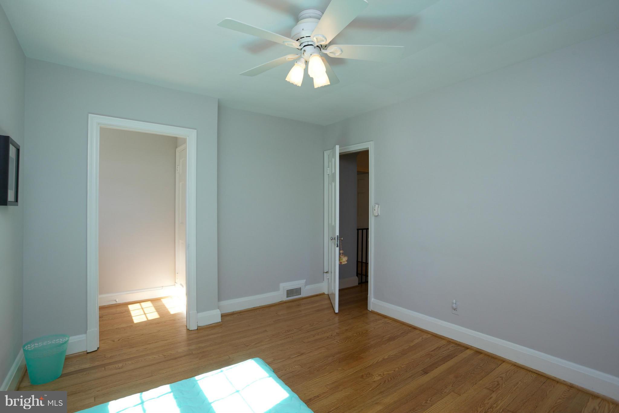 8 Aintree Road Towson, MD 21286 - Photo 18 of 27 an empty room with closet and a chandelier fan