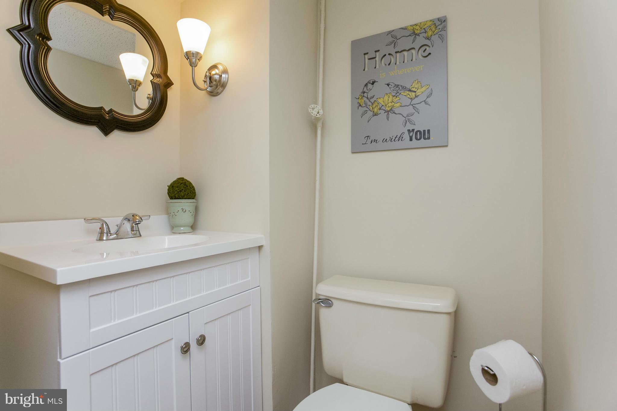 8 Aintree Road Towson, MD 21286 - Photo 25 of 27 a bathroom with a toilet a sink and a mirror