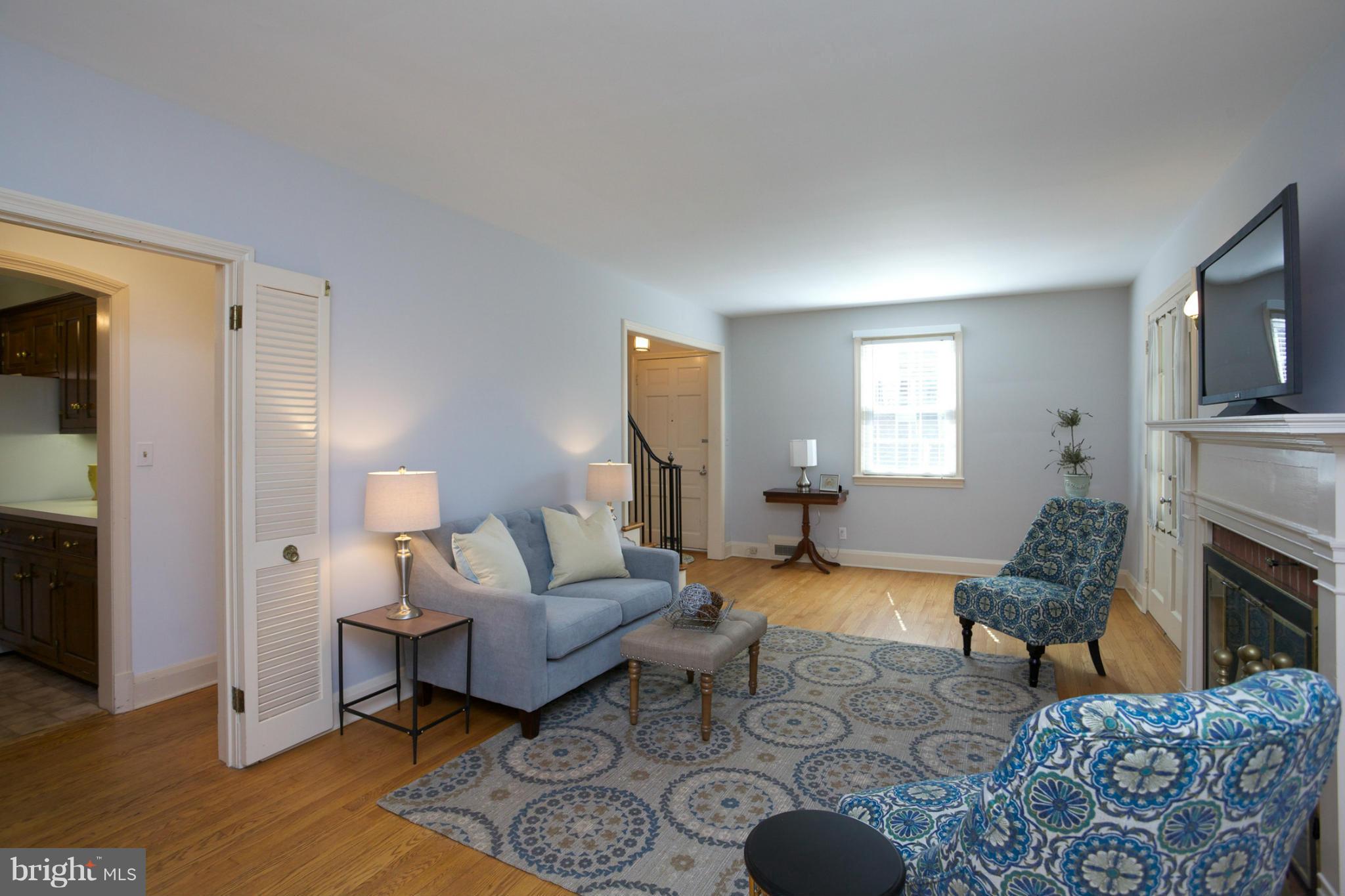 8 Aintree Road Towson, MD 21286 - Photo 9 of 27 a living room with furniture fireplace and rug