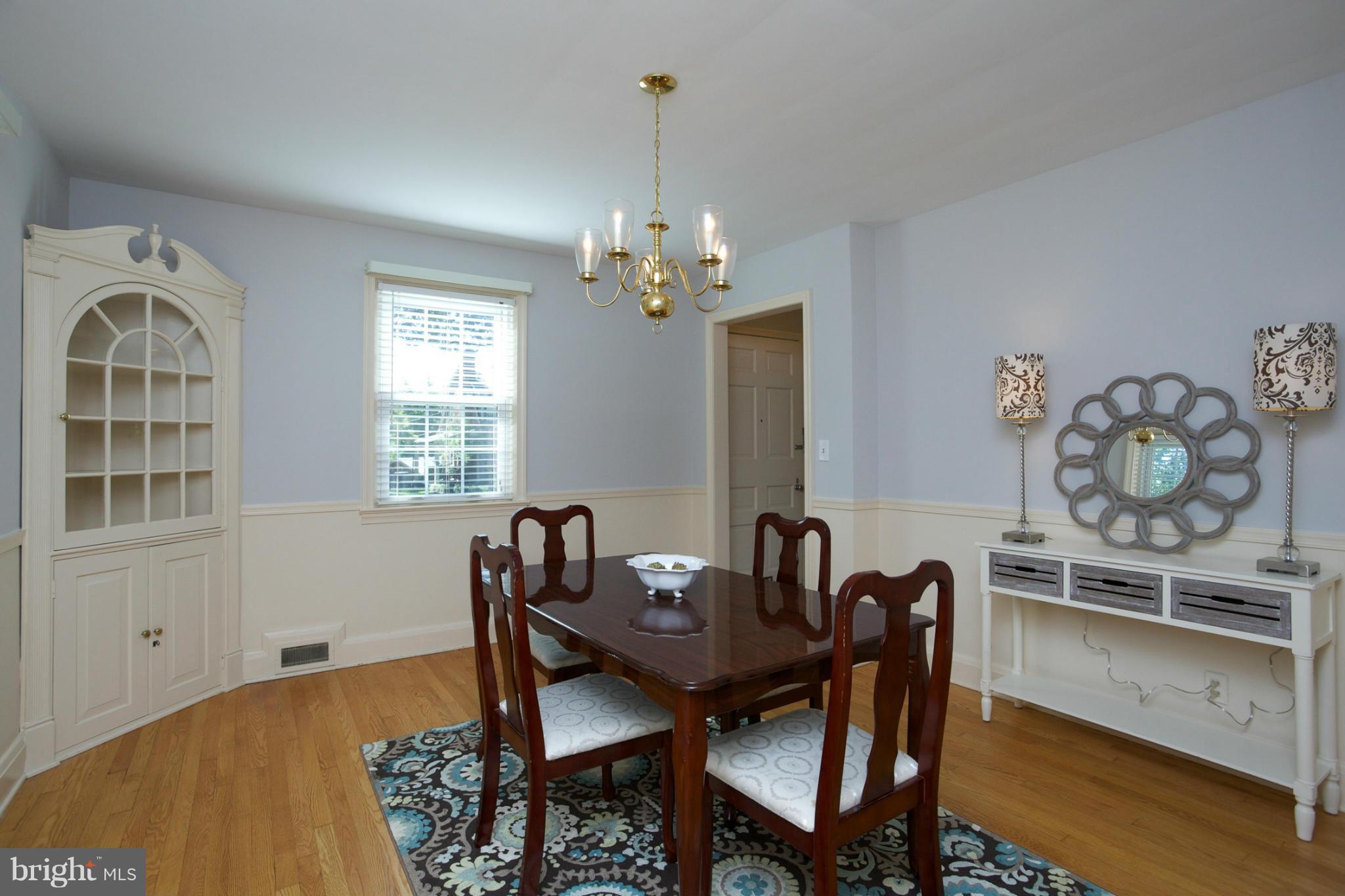 8 Aintree Road Towson, MD 21286 - Photo 10 of 27 a view of a dining room with furniture and wooden floor