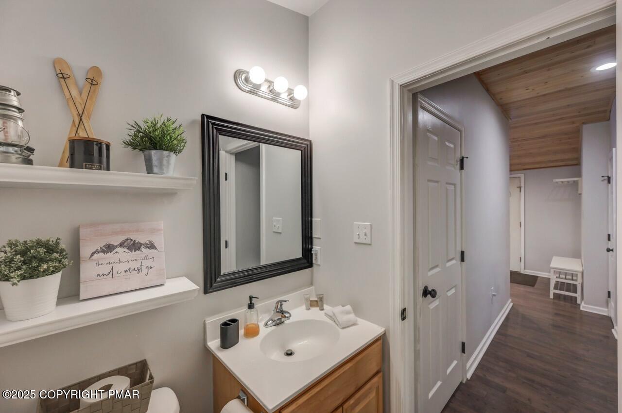 12 Hickory Road Lake Harmony, PA 18624 - Photo 43 of 86 a bathroom with a sink a mirror and a toilet