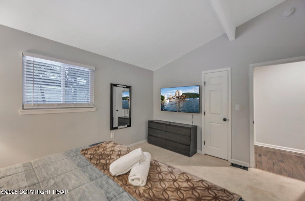 12 Hickory Road Lake Harmony, PA 18624 - Photo 46 of 86 a bedroom with a bed and a mirror