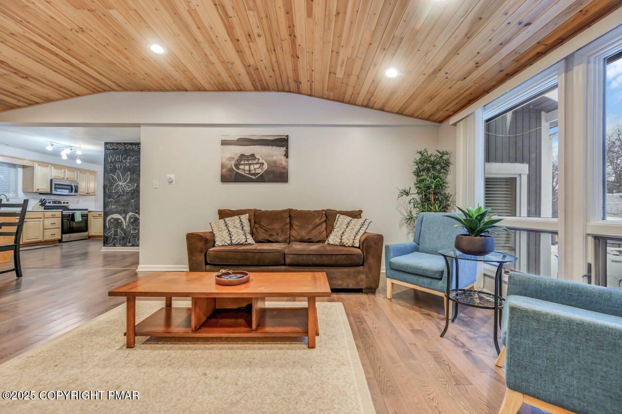 12 Hickory Road Lake Harmony, PA 18624 - Photo 49 of 86 a living room with furniture a wooden floor and a table