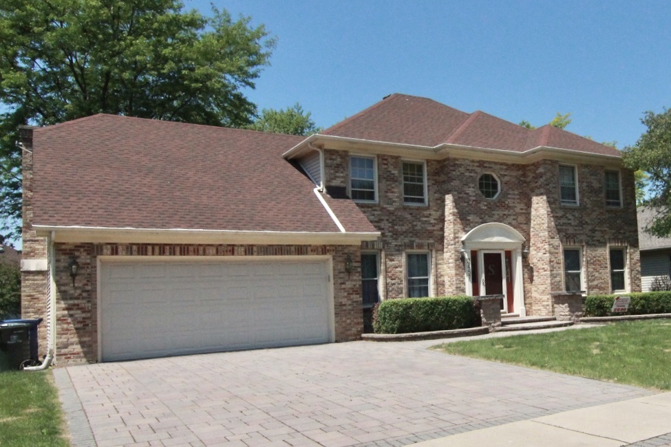 2457 Barkdoll Road Naperville, IL 60565 - Photo 1 of 27 a front view of a house with a yard and garage