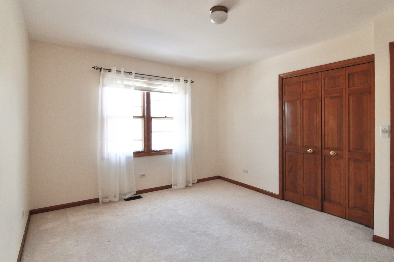 2457 Barkdoll Road Naperville, IL 60565 - Photo 19 of 27 an empty room with windows and closet