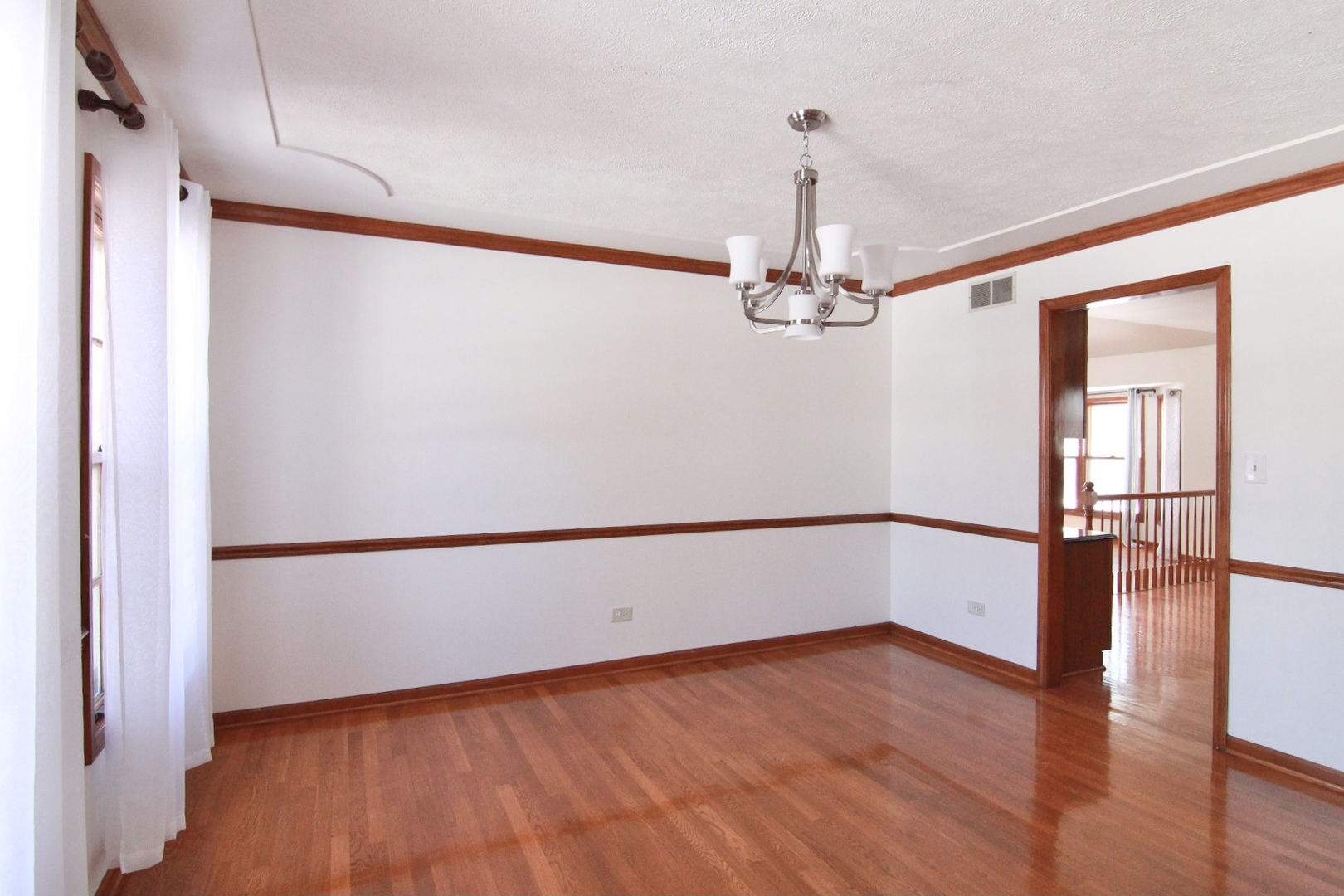 2457 Barkdoll Road Naperville, IL 60565 - Photo 3 of 27 a view of a livingroom with wooden floor
