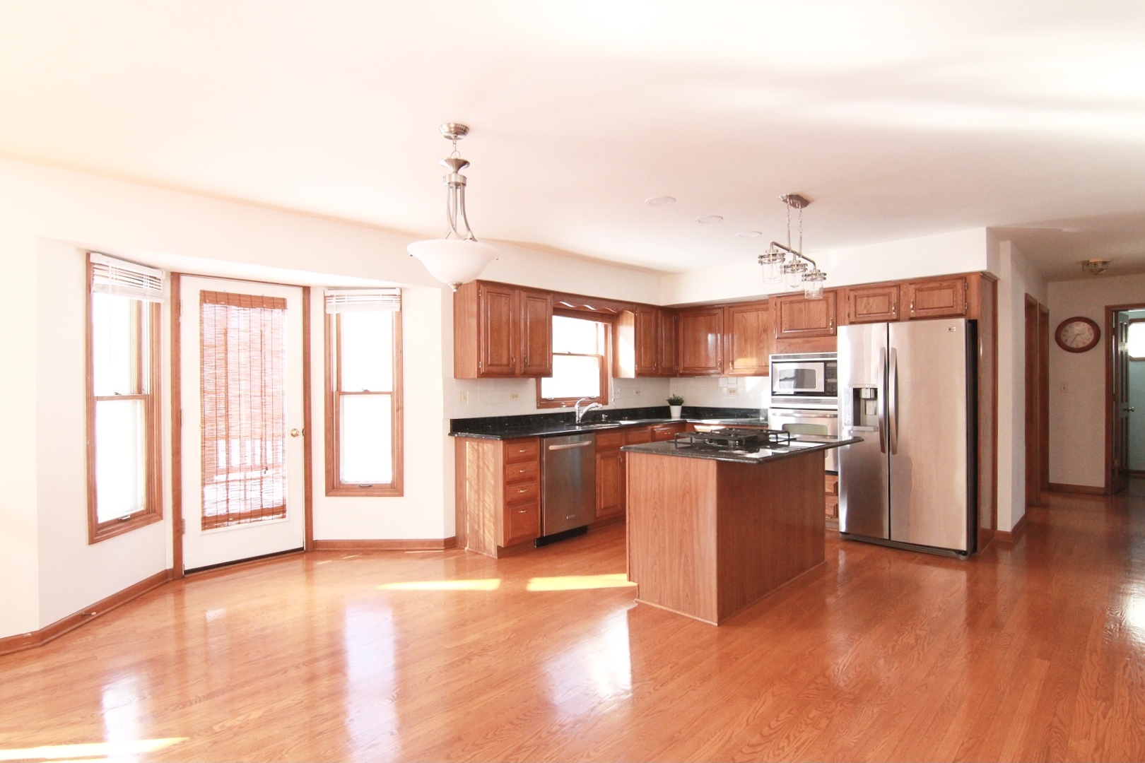 2457 Barkdoll Road Naperville, IL 60565 - Photo 9 of 27 a large kitchen with stainless steel appliances granite countertop a refrigerator and a stove top oven