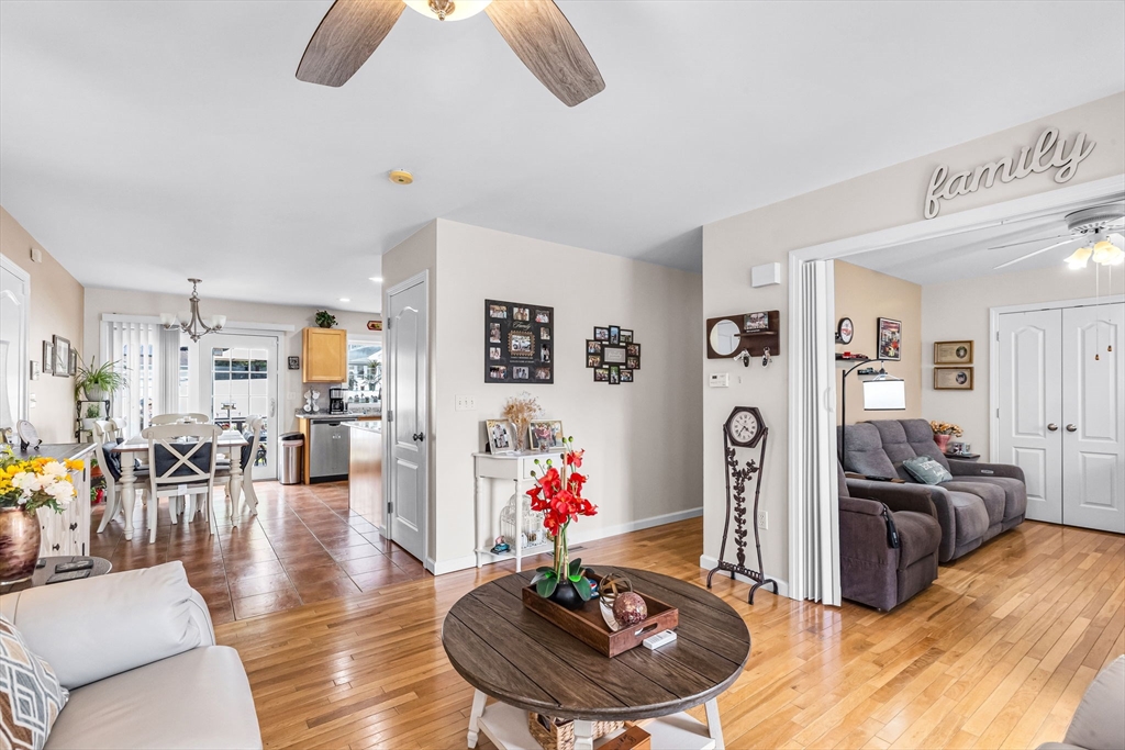 297 Christopher Drive Springfield, MA 01119 - Photo 12 of 30 a living room with furniture or couch and a dining table