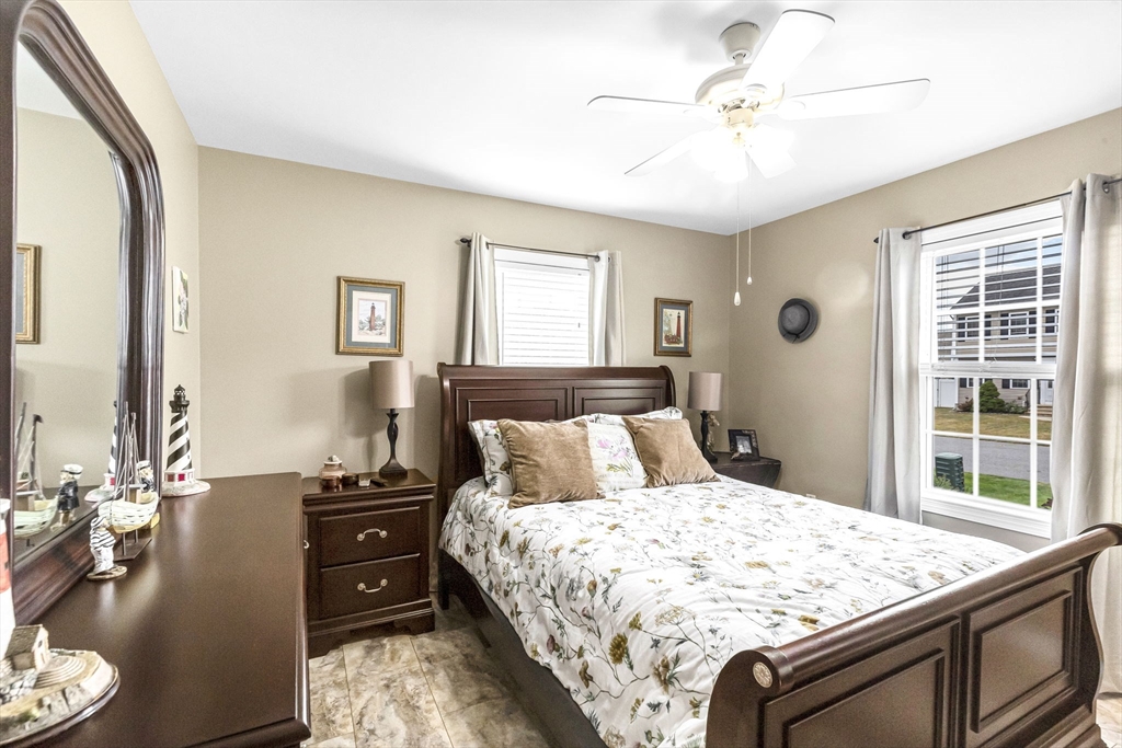 297 Christopher Drive Springfield, MA 01119 - Photo 20 of 30 a bedroom with a bed and a chandelier